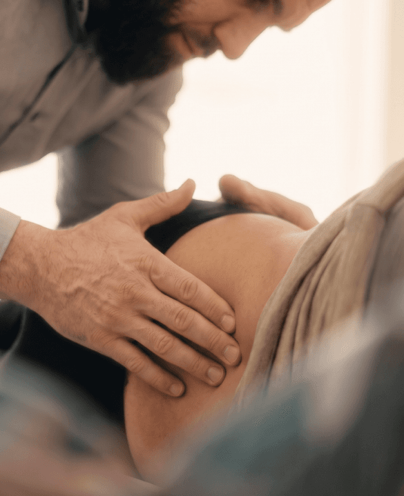 Dr. Abe performing a chiropractic adjustment